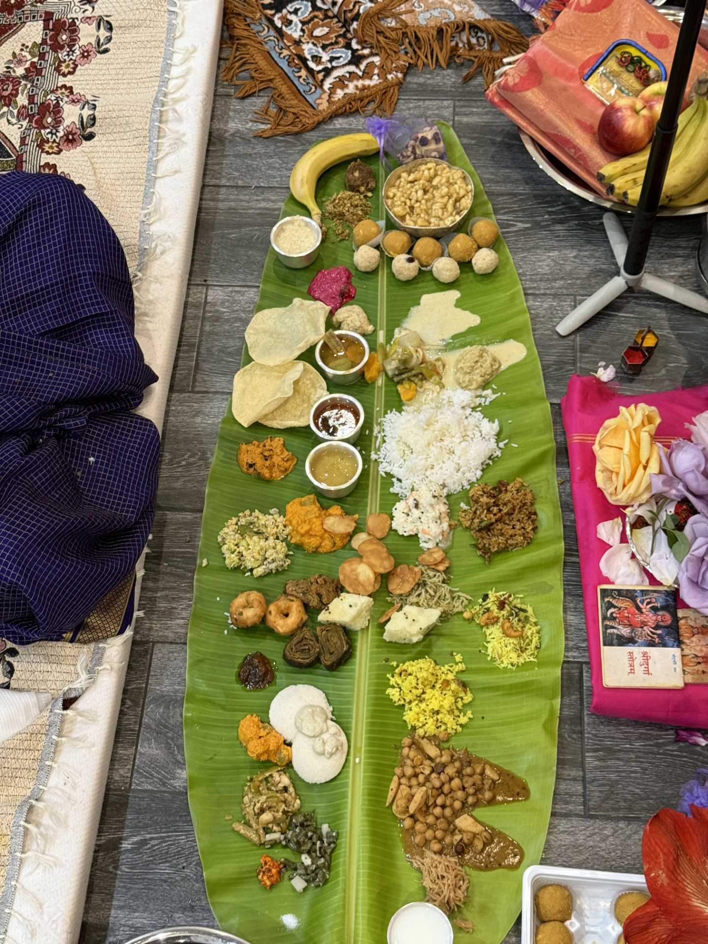 Naivedya offered to the Devi on a banana leaf — a full traditional Konkani spread