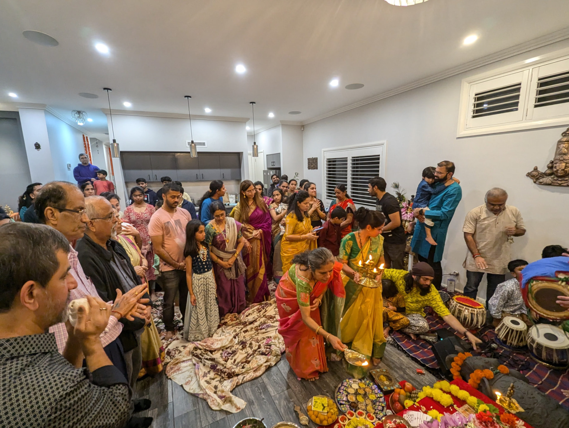 Aarti before the Devi as the whole kutumbh gathers around