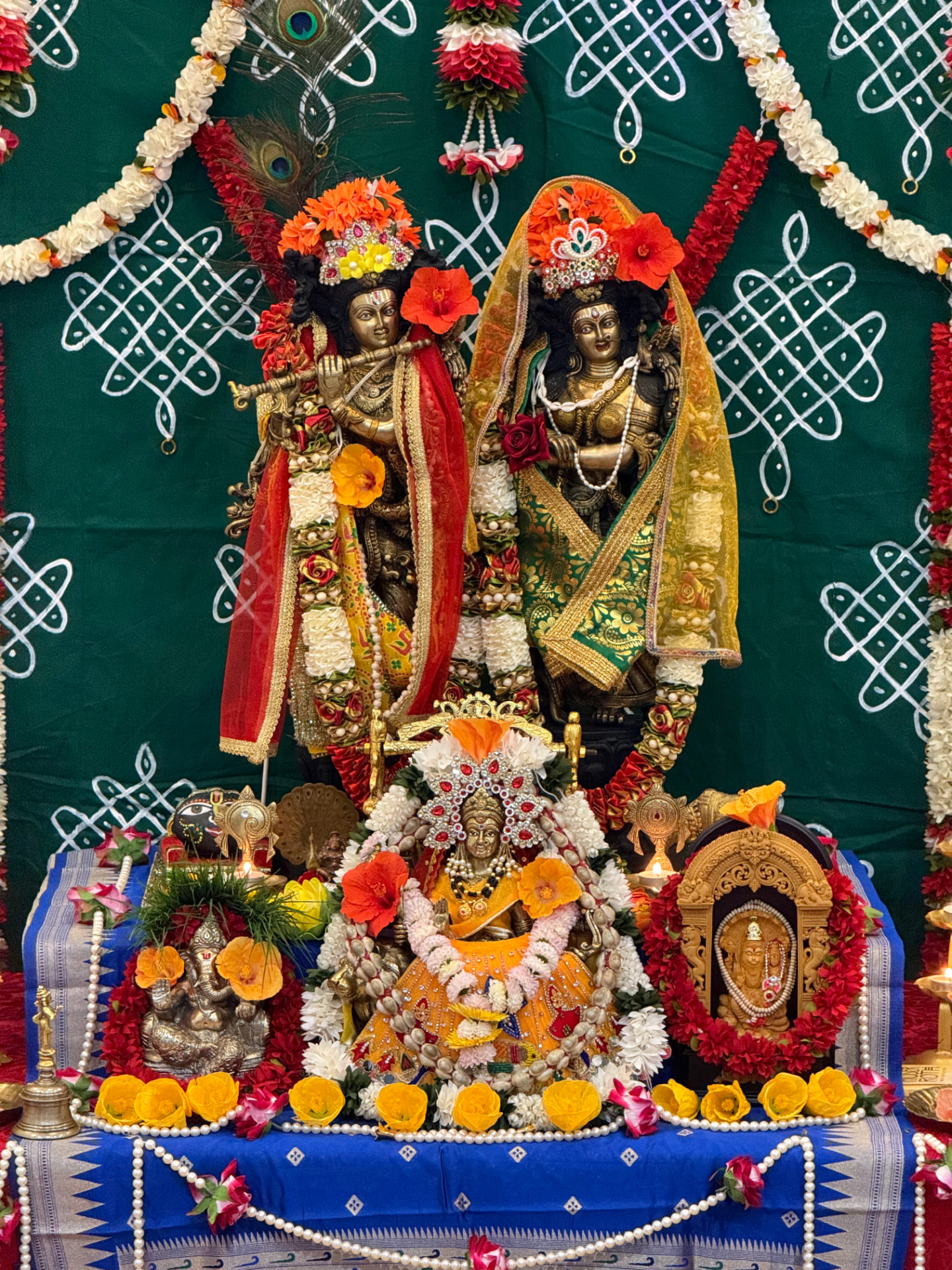 Shri Radha–Krishna and Devi adorned for the satsang